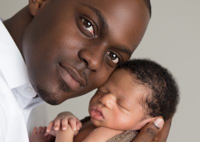 Gorgeous portrait of newborn boy with his daddy. Photo by Colleen Hight.