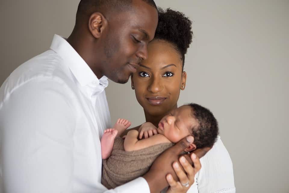 Family photo from a newborn portait session with Mom, Dad, and newborn baby boy