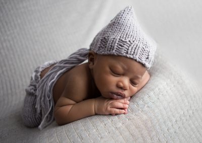 Newborn Boy Portraits in gray knit hat and pants, Suwanee, Georgia Newborn Studio