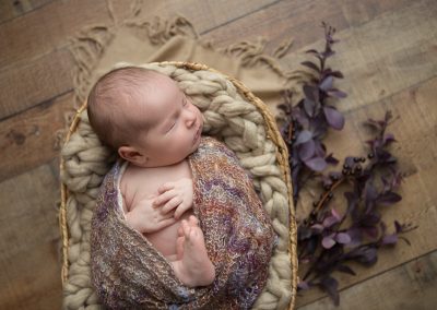 Newborn baby girl photo shoot with fall inspired colors and florals
